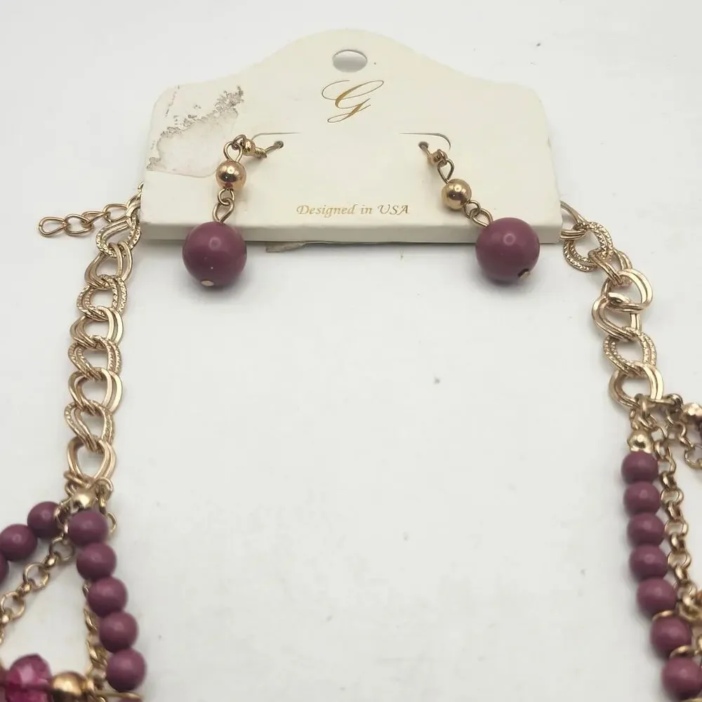 Glik's Burgundy Glass Bead Gold Tone Layered Bib Necklace Earrings Set Carded